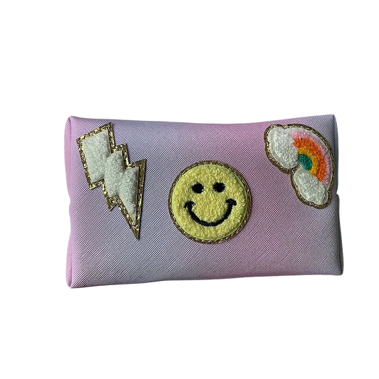 Washing bag designing with a smiley face, rainbow, and lightning bolt